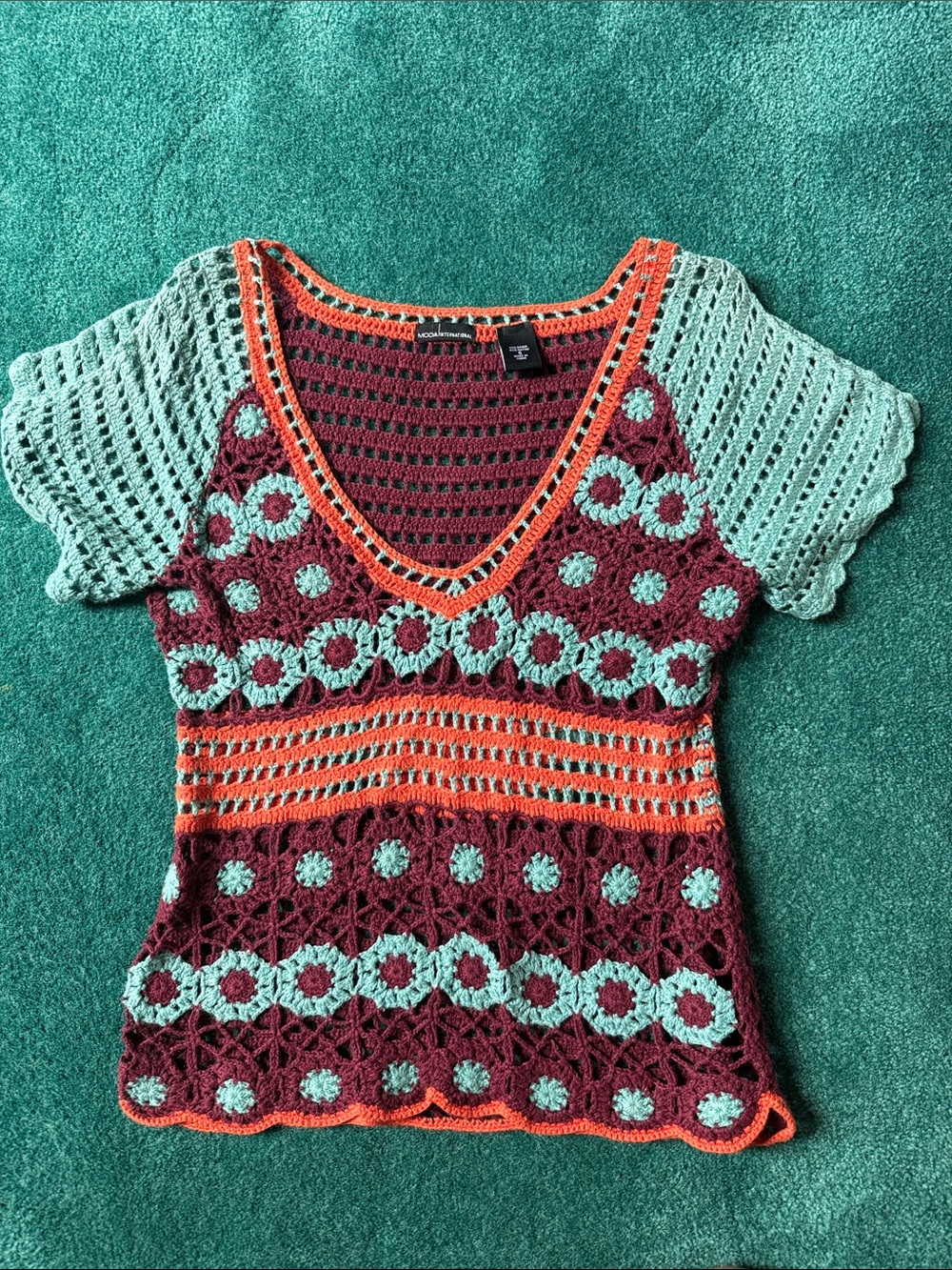 Moda International Crochet V‑Neck Short Sleeve Tunic in Teal, Burgundy & Orange